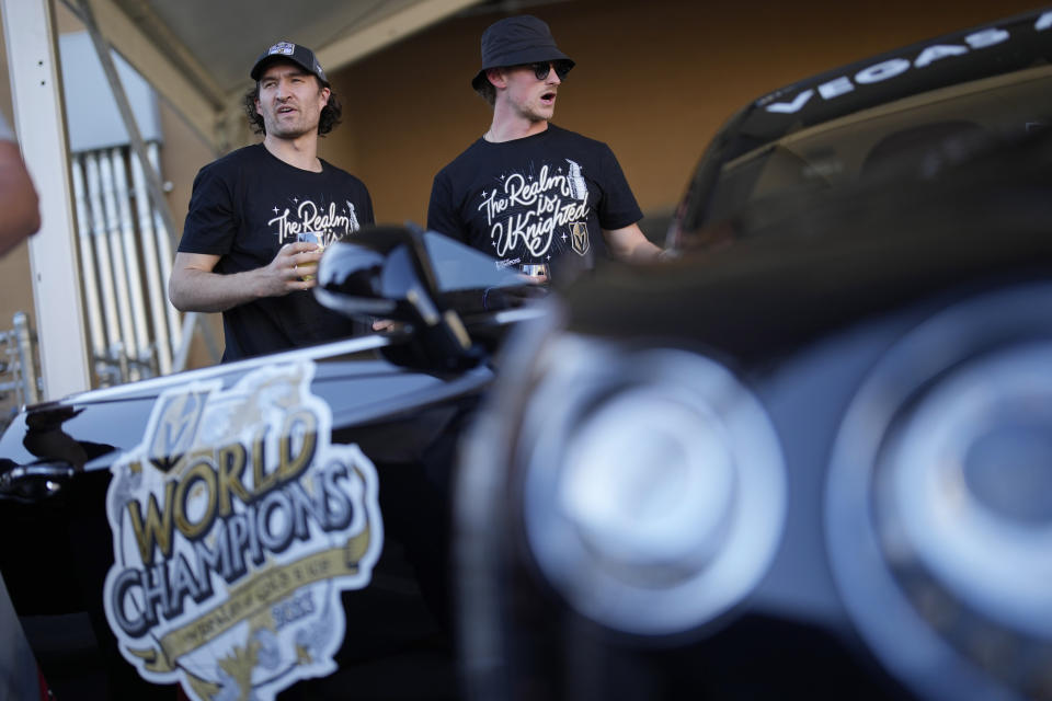 Vegas Golden Knights right wing Mark Stone, left, and center Jack Eichel wait before the starts of a parade along the Las Vegas Strip for the NHL hockey champions Saturday, June 17, 2023, in Las Vegas. (AP Photo/John Locher)