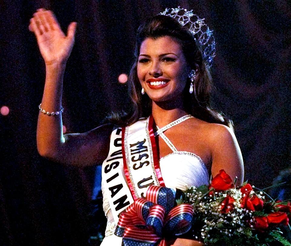 Miss USA 1996 Ali Landry waves to the crowd after being crowned on Feb. 2, 1996, in South Padre Island, Texas.