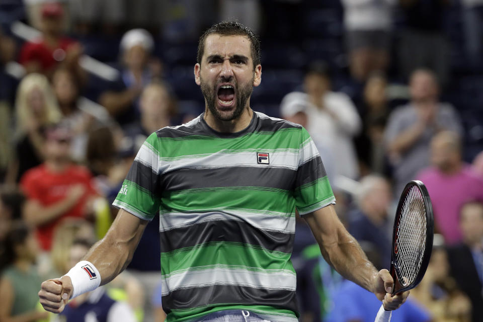 Marin Cilic of Croatia, celebrates his five set victory over Alex de Minau, of Australia, in a third-round tennis match at the U.S. Open tennis championship, Sunday, Sept. 2, 2018, in New York. (AP Photo/Mark Lennihan)