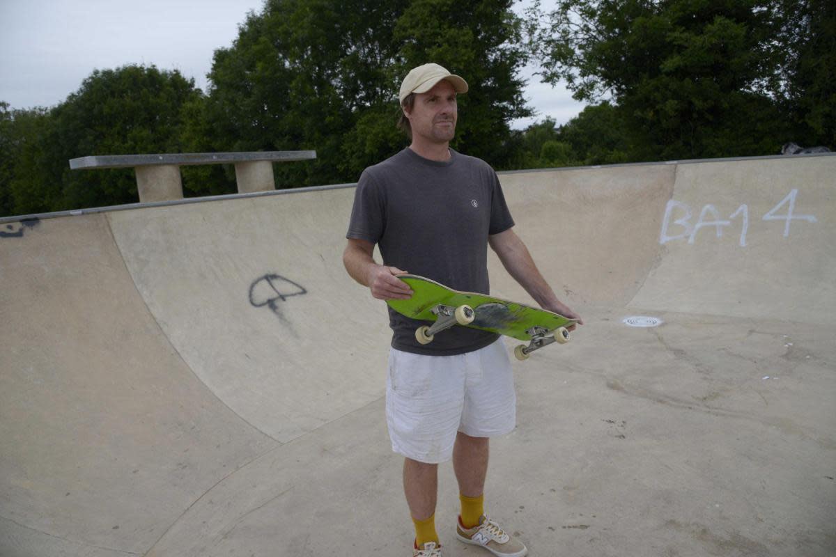 Visiting skateboard enthusiast James Baker takes a look at the graffiti at Bradford on Avon’s new skate park. <i>(Image: Trevor Porter)</i>