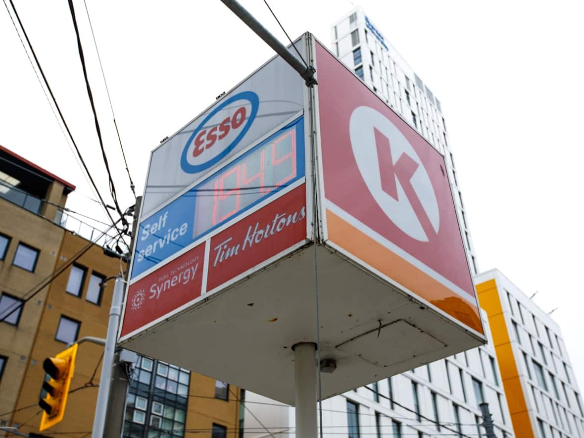 An Esso station lists a price of nearly $2 per litre of gasoline, in Toronto, on May 6. The price of a litre of gas is expected to rise above $2 on the long weekend, according to the website gaswizard.ca.  (Alex Lupul/CBC - image credit)