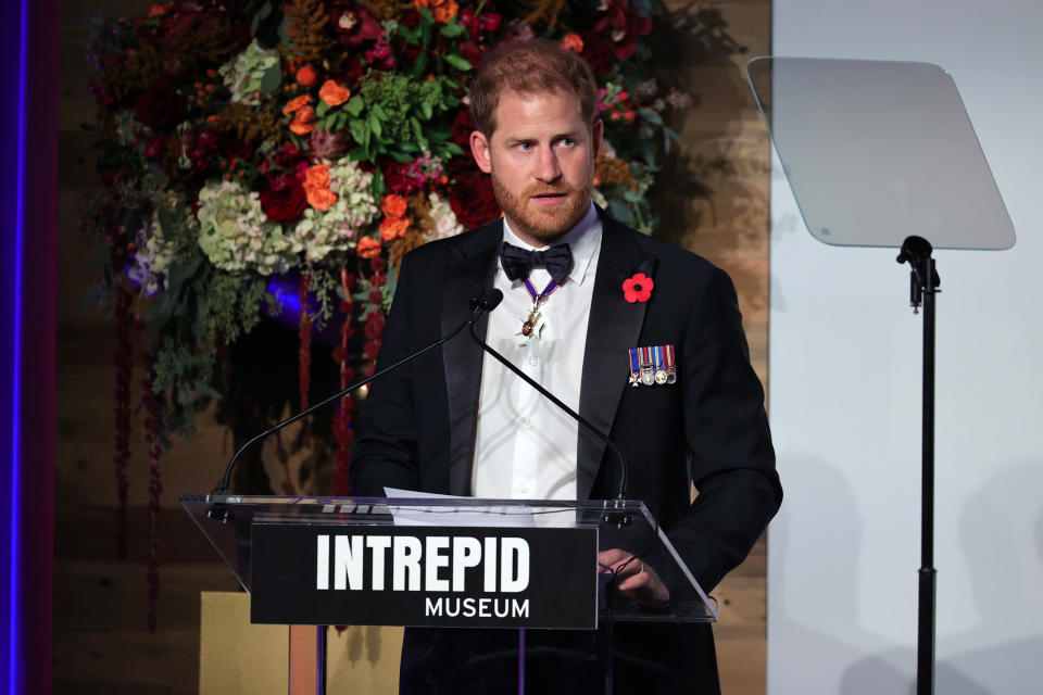 prince harry is speaking on stage at the intrepid