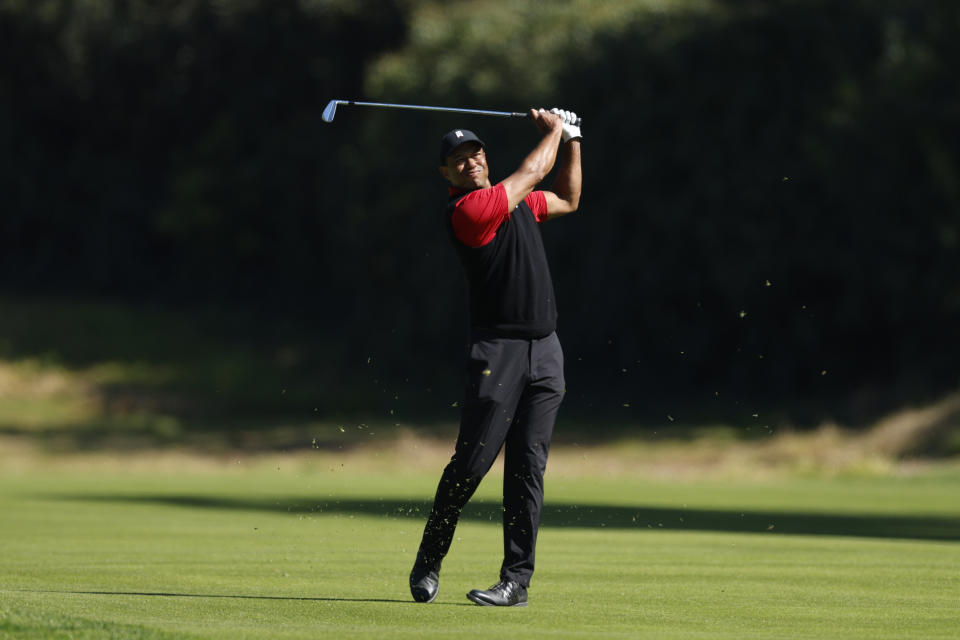 Tiger Woods hits from the fairway on the 12th hole during the final round of the Genesis Invitational golf tournament at Riviera Country Club, Sunday, Feb. 19, 2023, in the Pacific Palisades area of Los Angeles. (AP Photo/Ryan Kang)