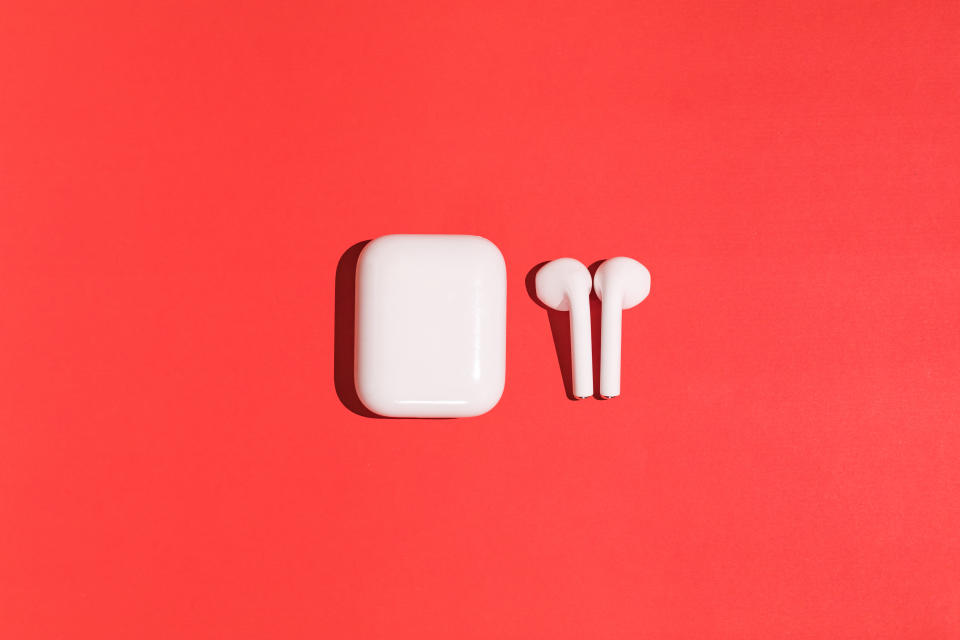 apple airpods, Trendy wireless white headphones on red background, Apple AirPods (2nd Generation) on red background