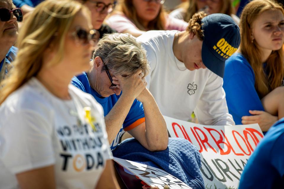 Emotions are still strong in Oxford as people fill Centennial Park in Oxford to listen to speakers before they marched to Oxford High School and back for the March For Our Lives Oxford event on Saturday, June 11, 2022. Students, teachers and parents shared their stories of loss following the shooting at the school and demanded that lawmakers enact gun control laws to keep these tragedies from happening again.