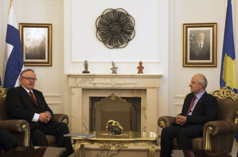 FILE - Former Finish President and Nobel Price winner for Peace Martti Ahtisaari, left, meets with Kosovo president Fatmir Sejdiu in Pristina, Kosovo, on Monday, June 15, 2009