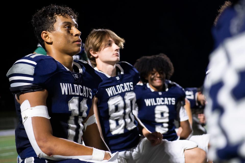 Dallastown junior Jalen Cook (11) listens as head football coach Levi Murphy addresses the team following a 24-20 win over South Western. Cook has his first Division I offer from Navy.