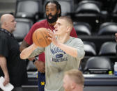 Denver Nuggets center Nikola Jokic, front, shoots the ball as center DeAndre Jordan looks on during practice for Game 2 of the NBA Finals Saturday, June 3, 2023, in Denver. (AP Photo/David Zalubowski)