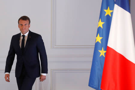 French President Emmanuel Macron arrives to attend a news conference to unveil his policy response to the yellow vests protest, at the Elysee Palace in Paris, France, April 25, 2019. REUTERS/Philippe Wojazer