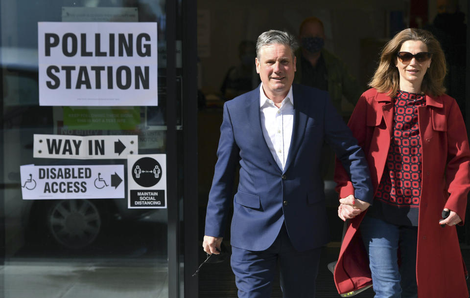 Labour leader Sir Keir Starmer and his wife Victoria leave after casting their vote in the local and London Mayoral election, at Greenwood Centre polling station, in London,, Thursday May 6, 2021. Millions of people across Britain will cast a ballot on Thursday, in local elections, the biggest set of votes since the 2019 general election. A Westminster special-election is also taking place in Hartlepool, England. (Dominic Lipinski/PA via AP)