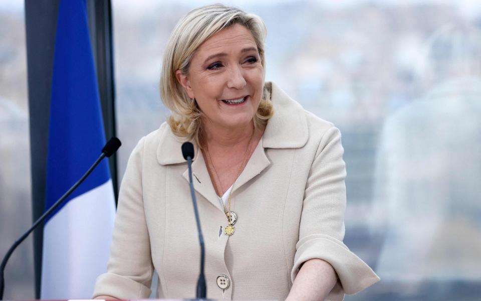 French far-Right National Rally presidential candidate Marine Le Pen delivers her New Year's greetings to the French press in Paris on January 26, 2022. - AFP