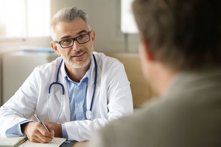 Doctor talking to patient in office