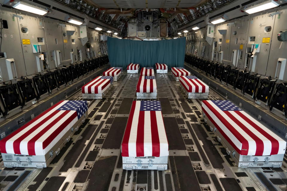 Flag-draped transfer cases of U.S. military service members 