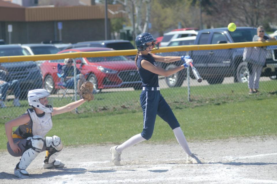 Payton Glasby connects with a pitch during a high school softball matchup between Gaylord St. Mary and Pellston last season.