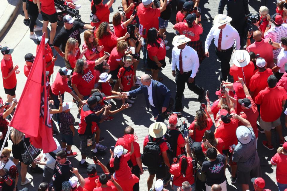 Texas Tech Red Raiders head coach Joey McGuire greets fans before the game against the Texas Longhorns at Jones AT&T Stadium and Cody Campbell Field.