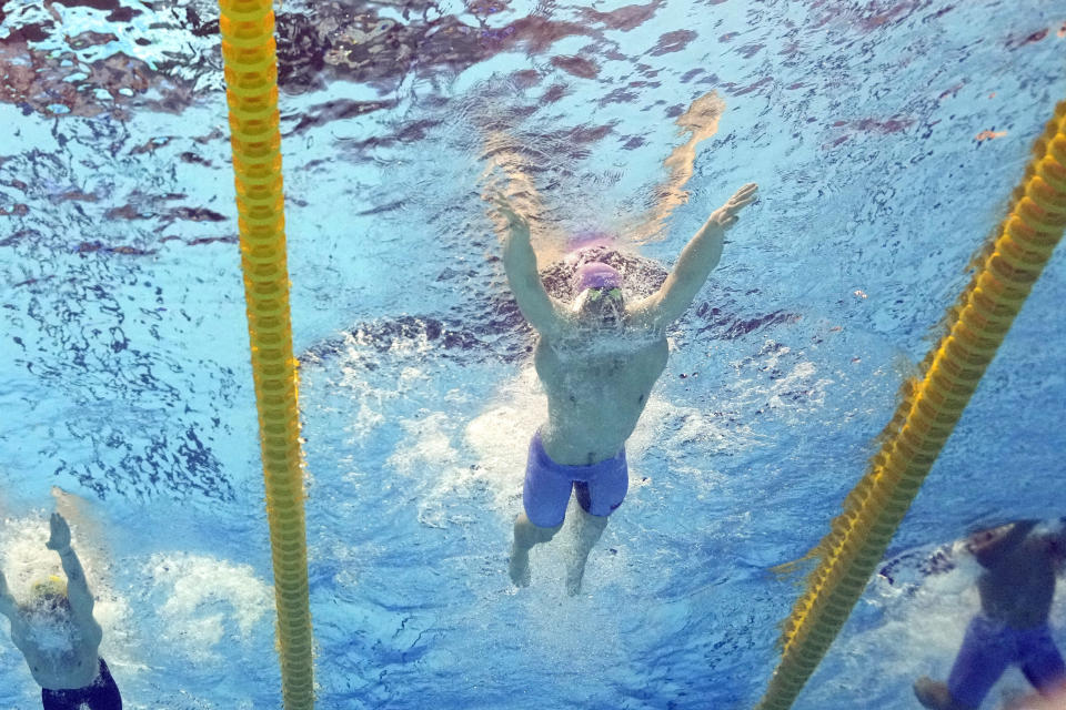 Qin Haiyang, of China, competes in the men's 200-meter breaststroke final at the World Swimming Championships in Fukuoka, Japan, Friday, July 28, 2023. Qin finished first. (AP Photo/David J. Phillip)