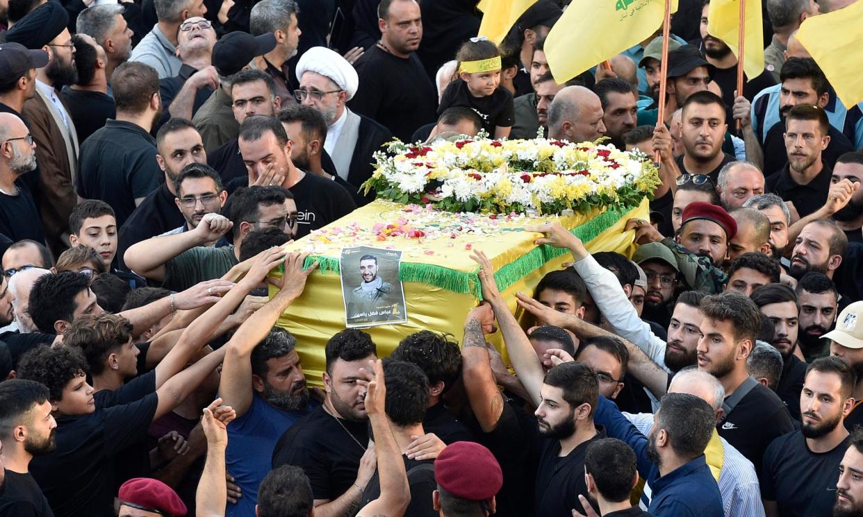 <span>Mourners in Beirut carry the coffin of one of the victims of pagers that exploded across Lebanon a day earlier.</span><span>Photograph: Wael Hamzeh/EPA</span>