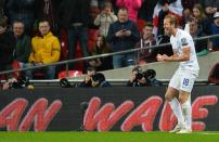 England's Harry Kane celebrates after scoring his team's fourth goal during a Euro 2016 Group E qualifying football match with Lithuania in London on March 27, 2015