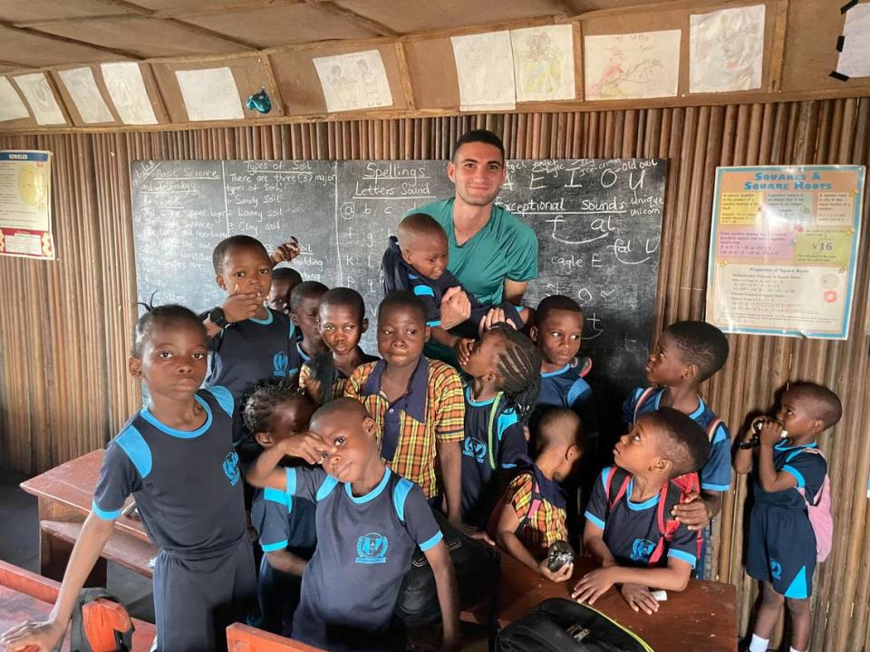 Cameron Mofid with students at the Part of Solution Nursery and Primary School in Lagos, Nigeria.