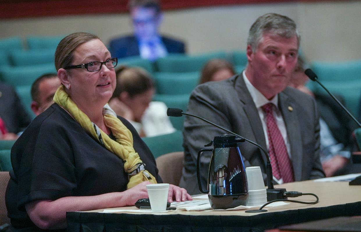 Terri Boyette, a Mesquite homeowner, on Wednesday describes her experience of having her home taken over by an unauthorized occupant to the Texas Senate Committee on Local Government. On the right, Rusty Adams, attorney at Texas A&M Real Estate Center, is watching the proceedings.