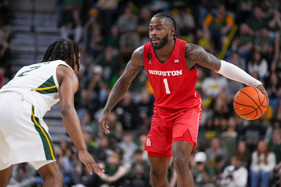 Houston guard Jamal Shead (1) works the floor against Baylor guard Jayden Nunn (2) during the second half of an NCAA college basketball game, Saturday, Feb. 24, 2024 in Waco, Texas. Houston won 82-76 in overtime. (AP Photo/Julio Cortez)
