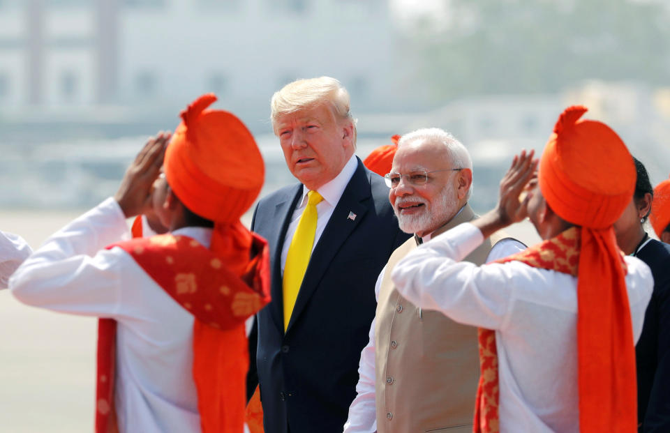 U.S. President Donald Trump is welcomed by Indian Prime Minister Narendra Modi as he arrives at Sardar Vallabhbhai Patel International Airport in Ahmedabad, India February 24, 2020. REUTERS/Al Drago