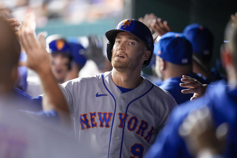 New York Mets' Brandon Nimmo celebrates after scoring on a hit by Francisco Lindor during the sixth inning of a baseball game against the Washington Nationals at Nationals Park, Friday, May 12, 2023, in Washington. (AP Photo/Alex Brandon)