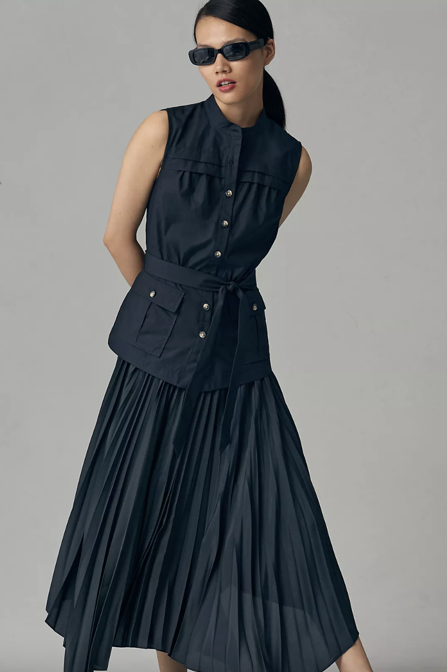 model wearing sunglasses and sleeveless navy blue By Anthropologie Sleeveless Vested Pleated Midi Dress (photo via Anthropologie)