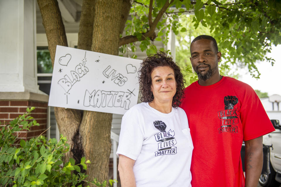 Regina and Donald Simon pose for a photograph in front of their home in Saginaw, Mich., Monday, July 13, 2020. On Sunday, July Donald looked in his vehicle to find what appears to be a noose, with a note attached. A retired Michigan optometrist faces federal charges for allegedly leaving nooses and notes mocking the Black Lives Matter movement inside the mixed-race couple's pickup truck, near or inside several stores and placing threatening phone calls. (Kaytie Boomer/Saginaw News via AP)