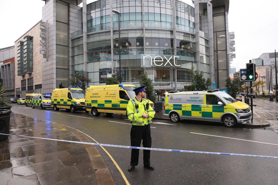 Police outside the Arndale Centre (PA)