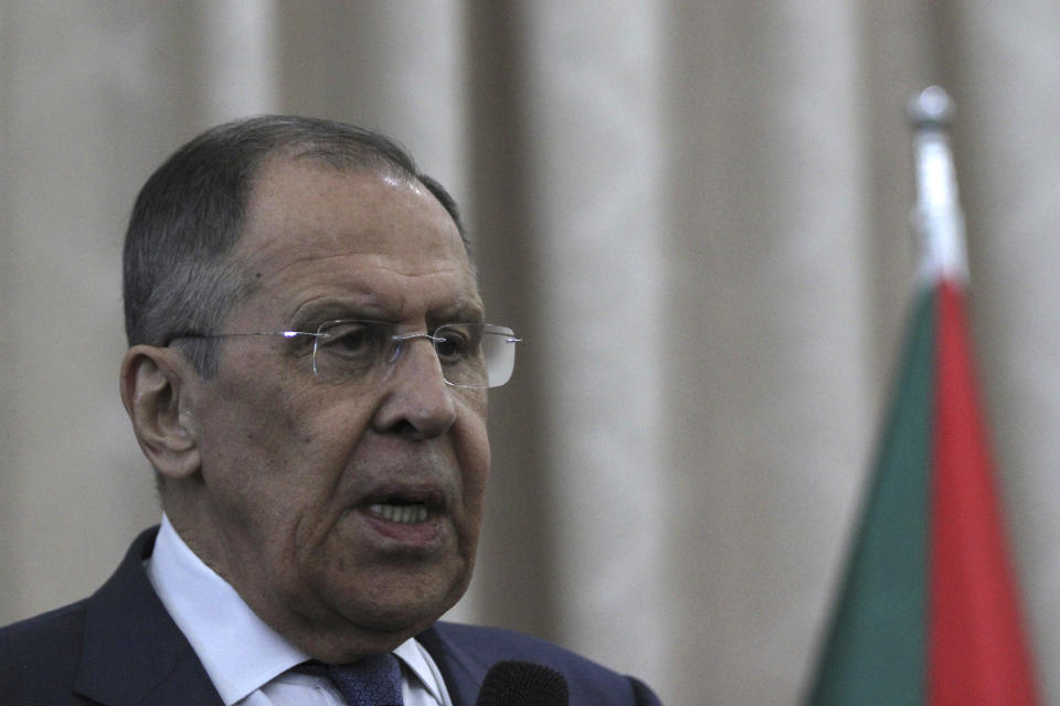 Russian Foreign Minister Sergei Lavrov and Sudanese acting foreign minister Ali al-Sadiq (not seen) give a joint press conference at the airport in Khartoum, Sudan, Thursday, Feb. 9, 2023. (AP Photo/Marwan Ali)