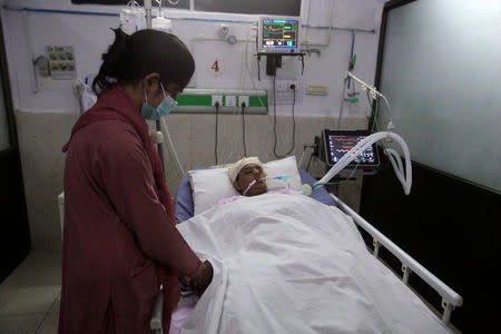 A nurse cares for a woman injured during shelling along the disputed border between Pakistan and India at CMH hospital in Sialkot, Pakistan September 22, 2017. REUTERS/Mohsin Raza