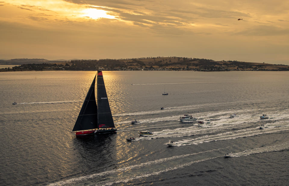 In a photo provided by Rolex, Comanche arrives to Hobart, Australia, to claim line honors in the Sydney to Hobart yacht race Saturday, Dec. 28, 2019. (Carlo Borlenghi/Rolex via AP)