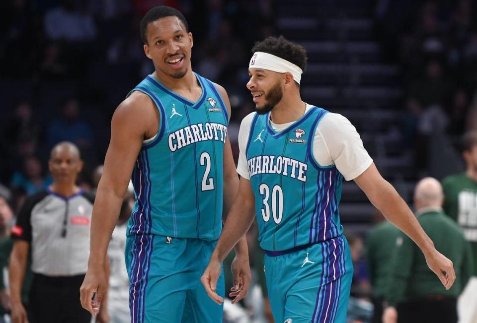 Charlotte Hornets forward Grant Williams, left and guard Seth Curry, right, joke during action against the <a class="link " href="https://sports.yahoo.com/nba/teams/milwaukee/" data-i13n="sec:content-canvas;subsec:anchor_text;elm:context_link" data-ylk="slk:Milwaukee Bucks;sec:content-canvas;subsec:anchor_text;elm:context_link;itc:0">Milwaukee Bucks</a> at Spectrum Center in Charlotte, NC on Thursday, February 29, 2024. JEFF SINER/jsiner@charlotteobserver.com