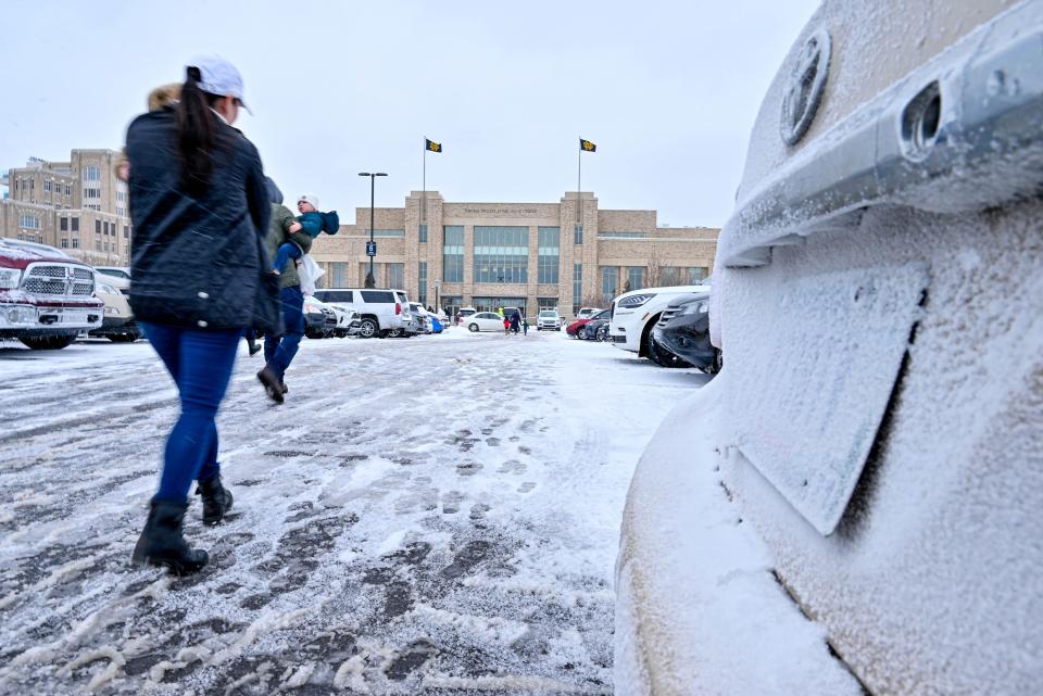 Jan 13, 2024; South Bend, Indiana, USA; Fans enter the Purcell Pavilion in blowing snow and cold conditions before the game between the Notre Dame Fighting Irish and the Florida State Seminoles. Mandatory Credit: Matt Cashore-USA TODAY Sports ORG XMIT: IMAGN-729279 ORIG FILE ID: 20240113_cec_sc5_095.JPG