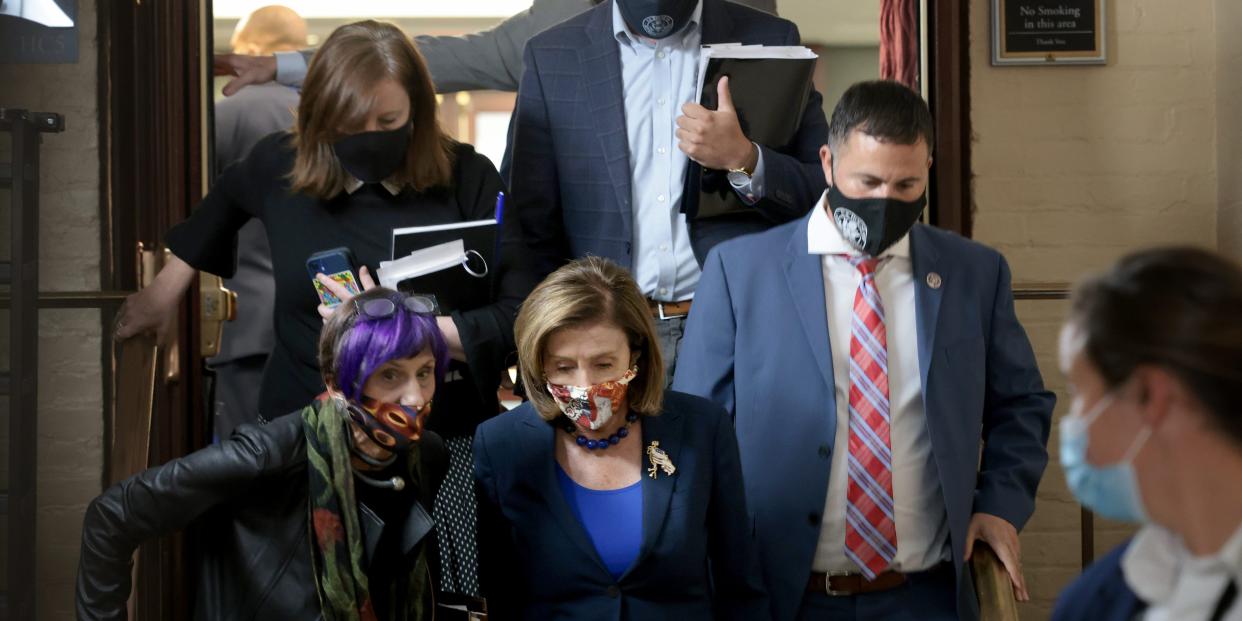 Speaker of the House Nancy Pelosi confers with Rep. Rosa DeLauro as she departs a Democratic caucus meeting at the US Capitol on October 1, 2021 in Washington, DC.