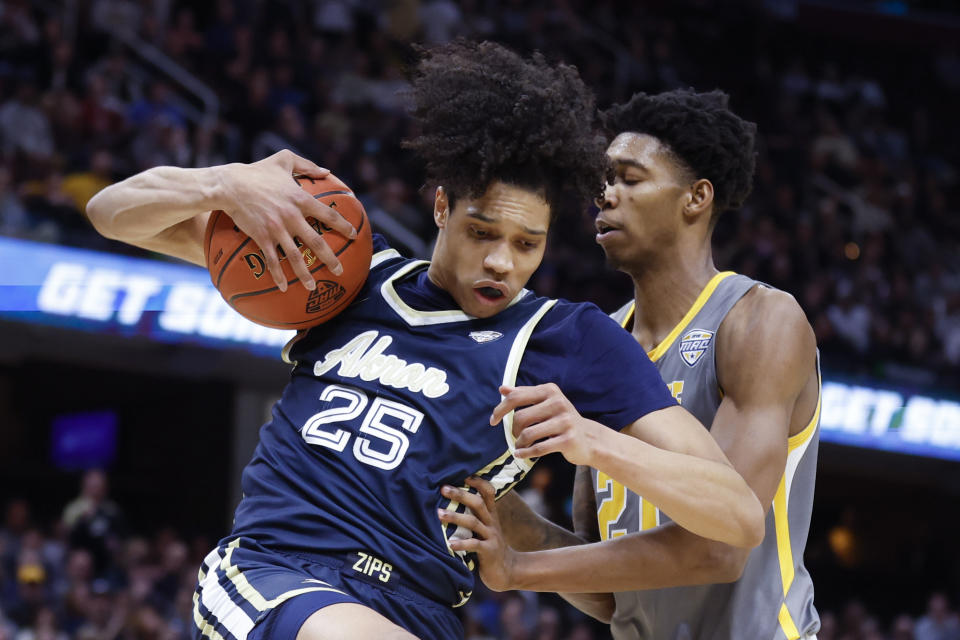 FILE - Akron's Enrique Freeman (25) rebounds against Kent State's Justyn Hamilton (21) during the second half of an NCAA college basketball game for the championship of the Mid-American Conference men's tournament Saturday, March 12, 2022, in Cleveland. Freeman had 16.8 points and 11.2 rebounds per game last season, making him one of just 12 Division I players to average a double-double. (AP Photo/Ron Schwane, File)