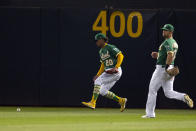 Oakland Athletics center fielder Cristian Pache (20) runs down Los Angeles Angels' Taylor Ward's RBI double during the fifth inning of a baseball game, Monday, Oct. 3, 2022, in Oakland, Calif. (AP Photo/D. Ross Cameron)