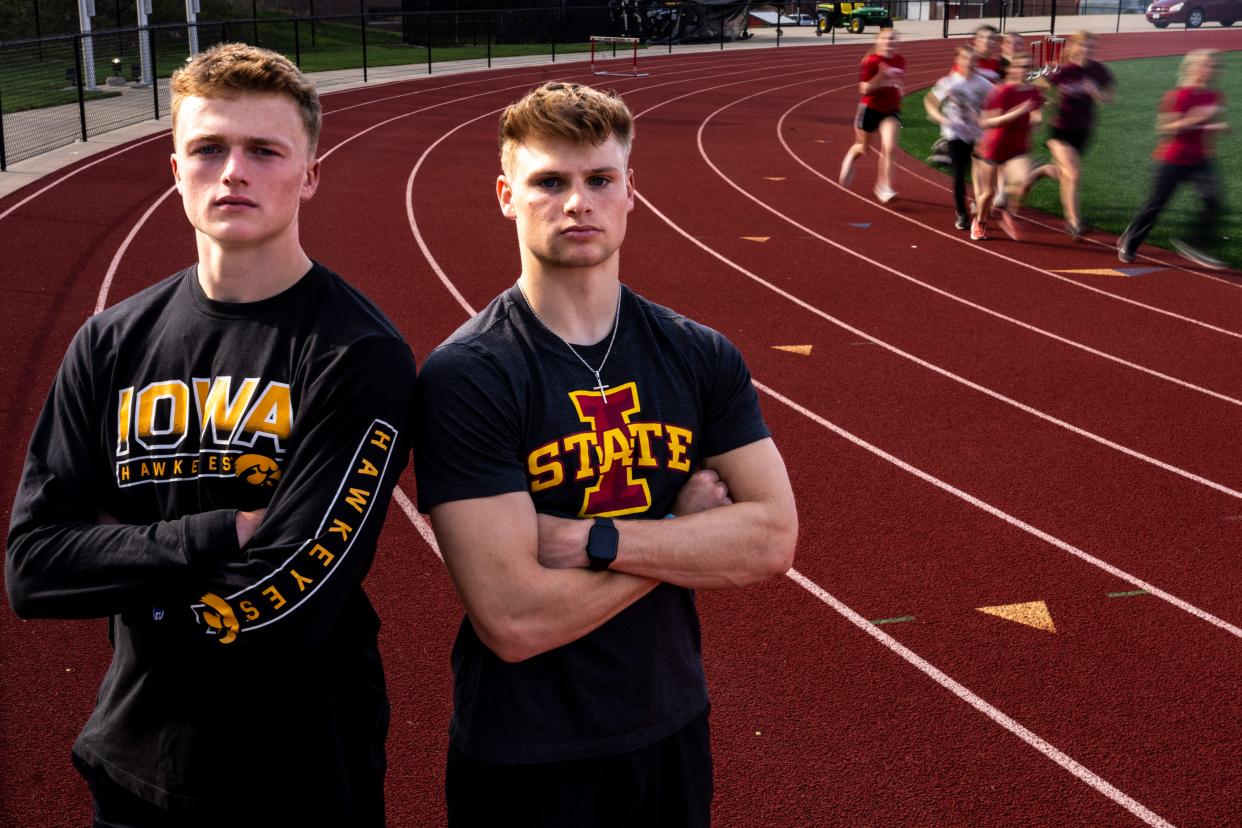 Iowa football commit Brevin Doll and Iowa State football commit Aiden Flora pose for a portrait during track practice at Adel DeSoto Minburn High School on Wednesday, April 17, 2024, in Adel.
