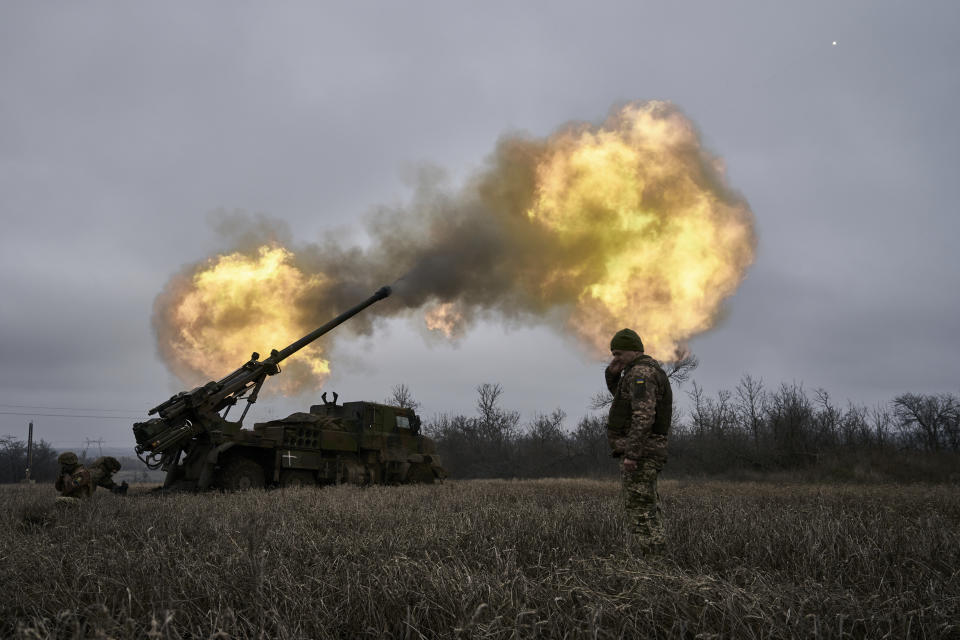 Ukrainian soldiers fire a French-made CAESAR self-propelled howitzer towards Russian positions near Avdiivka, Donetsk region, Ukraine, Monday, Dec. 26, 2022. (AP Photo/Libkos)