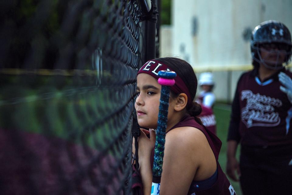 Estively Pena watches her team at bat during the Divas game against Verona on May 12, 2022 in Paterson. The Paterson Divas, 10 and under softball team is raising funds to play in a July tournament in Puerto Rico.