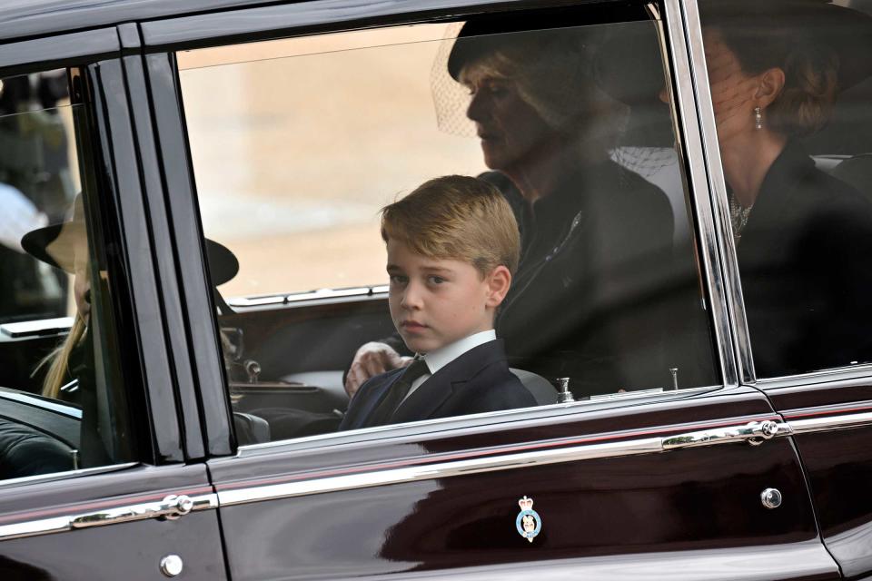 Prince George of Wales follow by car the coffin of Queen Elizabeth II as it travels from Westminster Abbey to Wellington Arch during the State Funeral Service of Britain's Queen Elizabeth II, Monday, Sept. 19, 2022, in London.<span class="copyright">Loic Venance—Pool Photo/AP</span>