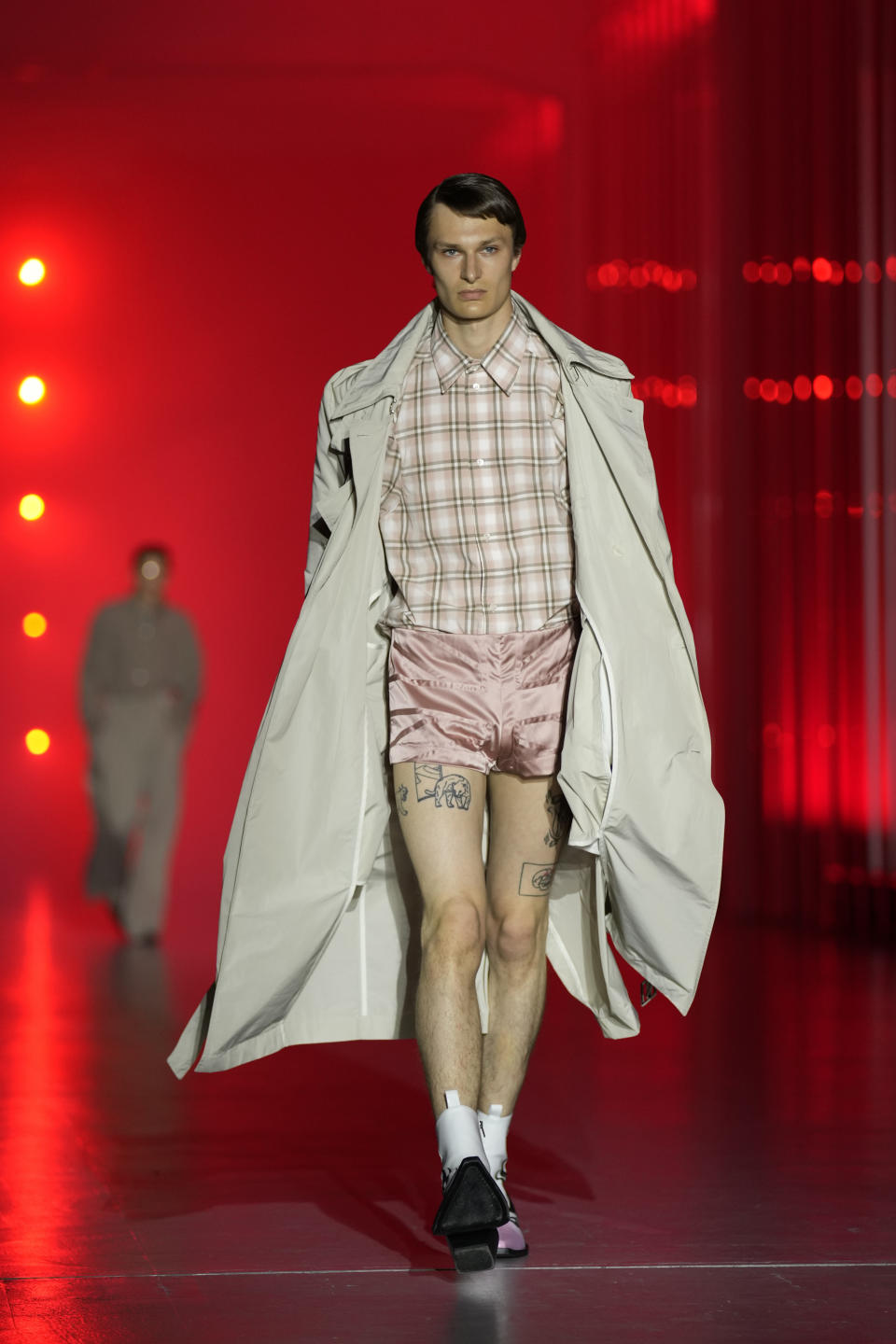 A model wears a creation as part of the Jordanluca men's and women's Spring Summer 2024 collection, unveiled during the Fashion Week in Milan, Italy, Saturday, June 17, 2023. (AP Photo/Antonio Calanni)