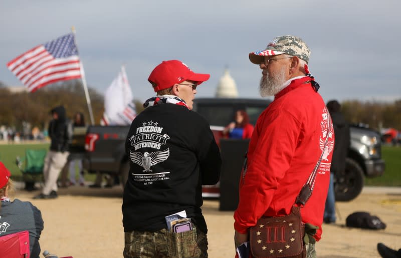 Militia members and pro-gun rights participating in the "Declaration of Restoration" rally listen to speakers in Washington, D.C.
