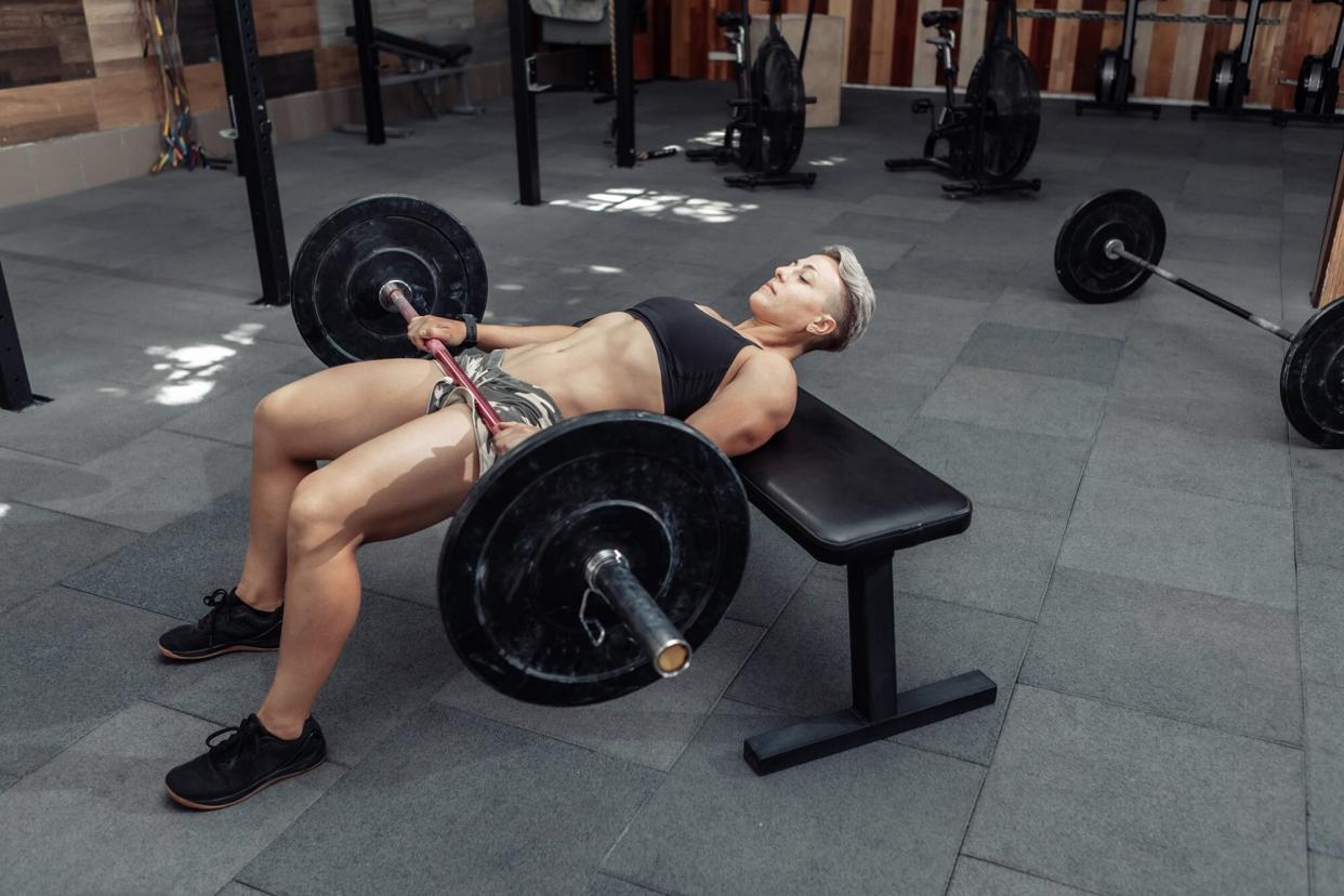 Woman performing a barbell hip thrust