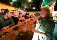 Owner Michael Mattson toasts the re-opening of the Friends and Neighbors bar in Appleton