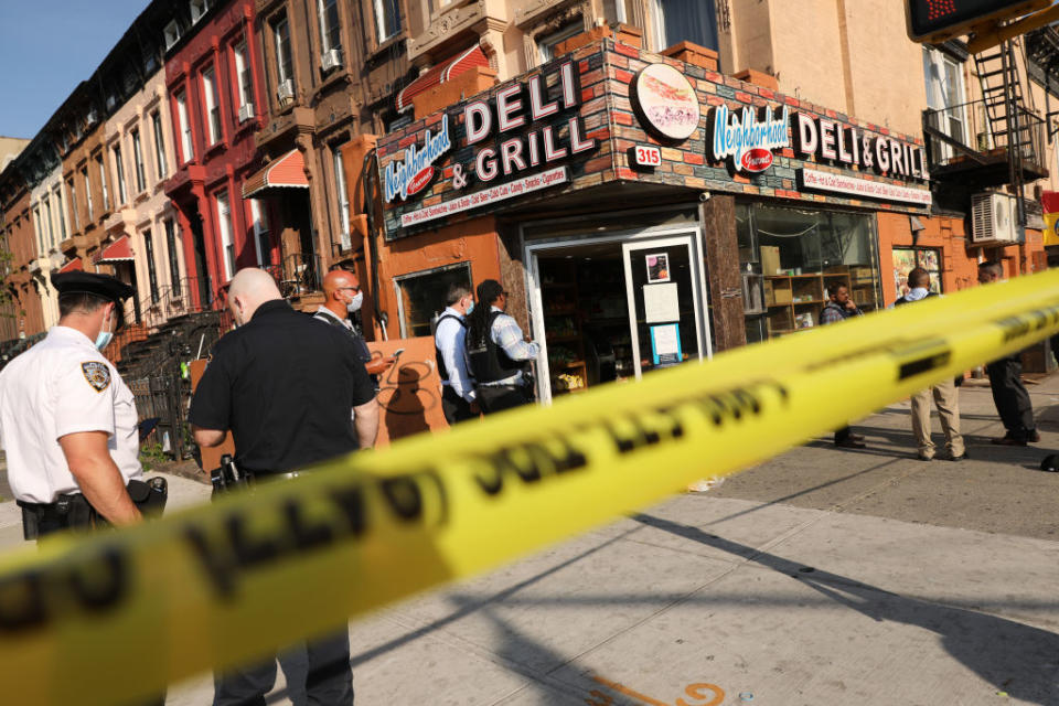 Police stand at the scene of a shooting which happened as Save Our Streets (S.O.S.) was holding a peace march last month in response to a surge in shootings in the Bedford Stuyvesant neighbourhood in Brooklyn, NY. Source: Getty