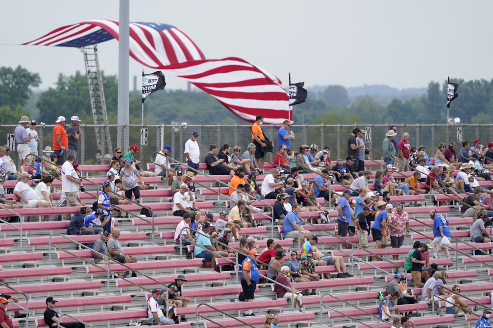 Fans socially distance in the stands due to COVID-19 as they watch the IndyCar auto race at World Wide Technology Raceway on Saturday, Aug. 29, 2020, in Madison, Ill. (AP Photo/Jeff Roberson)