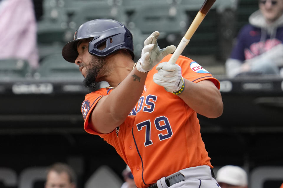 Houston Astros' Jose Abreu watches his single during the first inning of a baseball game against the Chicago White Sox in Chicago, Sunday, May 14, 2023. (AP Photo/Nam Y. Huh)
