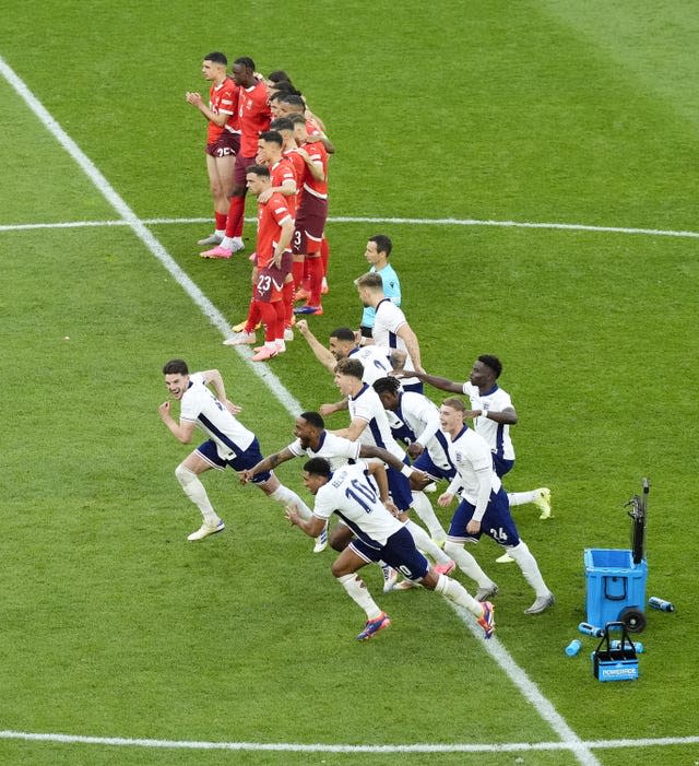 England players celebrate after Trent Alexander-Arnold (not pictured) scores the winning penalty